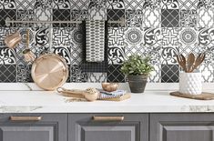 a kitchen counter with pots and pans sitting on it's backsplash