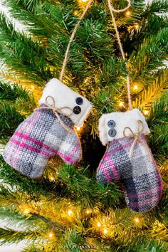 two mittens hanging from a christmas tree