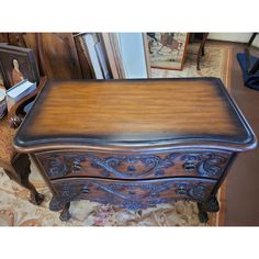 a wooden table with drawers on top of it