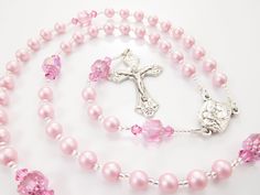 "- Personalized handmade rosary made with pink Czech glass pearls and crystals - Choice of medals and letters - Comes with a velour pouch and gift box This is for a little girl who LOVES PINK! This bubblegum pink handmade baptism rosary is made with matte pink Czech glass pearls and crystals and big pink Czech cathedral beads. It's a very cheerful rosary design. Comes with your choice of Baptism, First Communion, Confirmation, or other medals. Read below for details. Over 80 colorful designs to Spiritual Pink Jewelry For Birthday, Handmade Pink Rosary With Round Beads, Pink Beaded Spiritual Rosary, Pink Rosary With 8mm Beads For Gift, Handmade Pink Rosary For First Communion, Pink Rosary With 8mm Beads As Gift, Pink Rosary With 8mm Round Beads, Pink 8mm Bead Jewelry For Valentine's Day, Pink Beaded Rosary With Round Beads