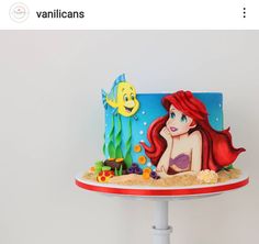 the little mermaid cake is decorated with fondant