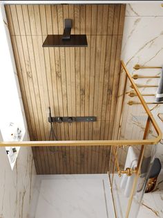 a bathroom with wood paneling and marble flooring on the walls, along with a shower stall