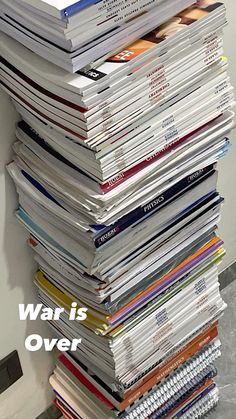 a stack of magazines sitting on top of each other