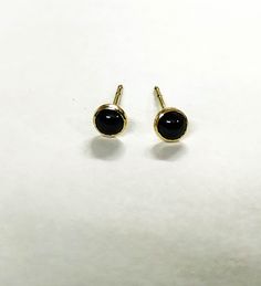 Tiny black Onyx Stones Studs in Recycled 14k solid yellow Gold : You are looking at a beautiful HAND MADE 14k gold earrings. Coming with silicone nuts. READY TO SHIP These studs look gorgeous - and so unique! Stone size: 4mm The earrings come with silicone closures If you are interested in 14K gold bars you can add: https://www.etsy.com/il-en/listing/622521369/14k-gold-backing-for-gold-stud-earrings?ref=shop_home_active_23 Fallow me on facebook for newest updates. http://www.facebook.com/pages/O Everyday Black Hypoallergenic Jewelry, Everyday Hypoallergenic Black Jewelry, Classic Black Pierced Earrings, Minimalist Black Earrings For Gift, Minimalist Black Earrings As Gift, Nickel Free Black Earrings For Anniversary, Nickel-free Black Earrings For Anniversary, Nickel-free Black Earrings For Gift, Black Dainty Hypoallergenic Jewelry