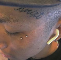 a person with ear piercings on their ears