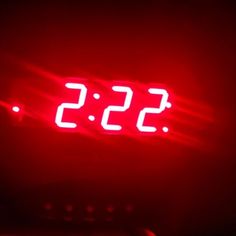 a red clock with the time 535 on it's face is lit up