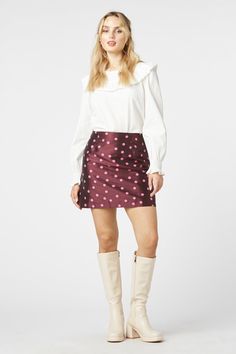 The Bonnie Spot Skirt by Princess Highway is a charming and versatile piece, perfect for adding a touch of playful elegance to your wardrobe. Featuring a classic polka dot pattern with a rich berry background and sweet pink scattered spots, this high-waisted A-line skirt is both flattering and fun. Designed with a high waist, this skirt accentuates the figure while providing a comfortable fit. The A-line cut flares slightly, offering a feminine silhouette that finishes above the knee. The skirt Berry Background, Background Sweet, Princess Highway, Posh Style, Vintage Clothes Women, Dress Gift, Knit Pants, Alternative Fashion, Above The Knee