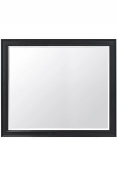 a black framed mirror on a white wall