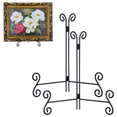 a painting is hanging on the wall next to a coat rack with flowers in it