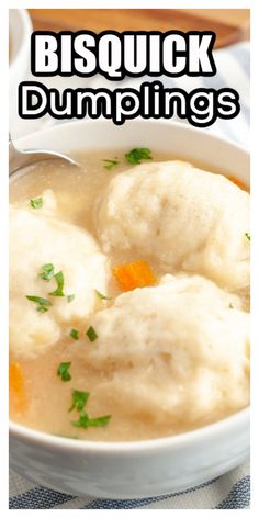 a white bowl filled with dumplings on top of a table