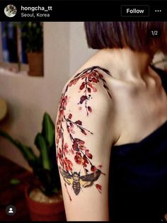 a woman with a butterfly tattoo on her arm