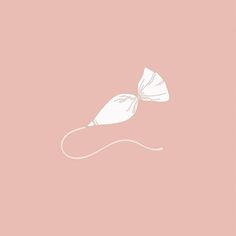 a white bow on top of a pink background