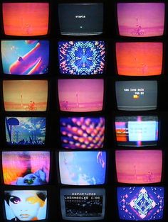 many televisions with different colored images on them