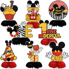 mickey mouse 1st birthday cupcake toppers with the number one on it and other decorations