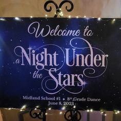 a sign that says welcome to night under the stars