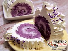 a purple cake with white frosting and sprinkles on a yellow plate