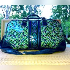 Vera Bradley Plastic Covered Cotton Medium Size Travel Bag. Great For Weekend Travel And Overnight Stays. Perfect Carryon Size With Lots Of Room For All Your Essentials. Very Good Used Condition. One Area Is Oxygenated But Not Noticeable Unless Closely Observed. See Last Picture. Interior No Noticeable Wear Or Tear Or Stains. What I Love Most Is That It’s Weather Proof. So Don’t Worry About Rain Or Snow Your Items Will Remain Waterproof. Blue Travel Bag With Removable Pouch For Weekend Trips, Blue Shoulder Bag With Removable Pouch For Weekend Trips, Blue Rectangular Weekender Bag For Trips, Blue Bag With Adjustable Strap For Weekend Trips, Blue Shoulder Bag With Luggage Sleeve For Weekend Trips, Blue Rectangular Duffle Bag For Trips, Blue Tote Travel Bag For Trip, Blue Rectangular Weekender Bag With Luggage Sleeve, Blue Rectangular Travel Bag For Shopping