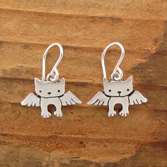 A very sweet tribute for your cat. They are 1/2 of an inch tall and handmade using solid sterling silver with solid sterling French ear wires. These will make you smile through those hard days. For the large matching necklace: https://www.etsy.com/listing/106961895/angel-kitty-necklace For the small matching necklace: https://www.etsy.com/listing/106971983/tiny-angel-kitty-necklace For the mother-daughter set: https://www.etsy.com/listing/106580243/mother-daughter-angel-cat-set Items are shipped Sterling Silver Cat Design Earrings For Gift, Cute Sterling Silver Dangle Earrings, Nickel-free Cat Ears Earrings As Gift, Nickel-free Cat Ears Jewelry For Gifts, Nickel-free Cat Ears Jewelry Gift, Sterling Silver Cat Ears Earrings, Sterling Silver Cat Ears Earrings Gift, Hypoallergenic Silver Cat Ears Jewelry, Whimsical Sterling Silver Hypoallergenic Jewelry