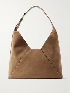 Brunello Cucinelli prioritizes Italian craftsmanship and premium materials above all else, so everything is made to last. This sleek tote is made from smooth suede in a slouchy shape and has an adjustable leather top handle to fit comfortably over your shoulder. Stow your wallet, phone and a few cosmetics inside. Elegant Suede Bag With Leather Lining, Elegant Suede Bag With Palladium Hardware, Sac Diy, Fabric Christmas Ornaments Diy, Suede Tote, Christmas Ornaments Diy, Womens Designer Handbags, Samana, Fabric Christmas Ornaments