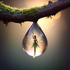 a glass droplet with a fairy inside it