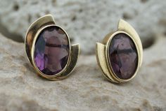 This is the perfect option for those who like cool, unique jewelry and the luxury, velvet shine of gold, violet. This earrings is well made, cute and/or elegant in design, and very desirable. The earrings have diamond smooth design . The earrings decorated with purple stones. The earrings have shape of oval. The earrings are stud. It is perfect for a gift for birthday, mother's day and holidays. ❤️ The earrings are 3/4'' by 5/16''. ❤️ There is a hallmark: 14K. ❤️The weight is about 4.6 g. ❤️The Modern Amethyst Gemstone Earrings, Modern Amethyst Earrings As Gift, Modern Purple Gemstone Earrings, Art Deco Jewelry Vintage, Purple Decor, Solid Gold Earrings, Amethyst Purple, Purple Stones, Solid Gold Jewelry