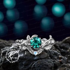 a green ring sitting on top of a rock