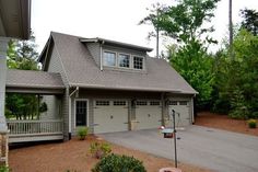 a two car garage is shown in front of a house