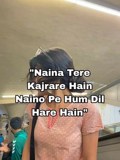 a woman standing next to an escalator with the caption'nahna tere kajra hain naino pe hum di hate hain