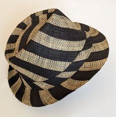 Lightweight fedora sun hat that is very comfortable to wear. Good protection from sun. Breathable light design.  Our fun striped hat will add style and chic to your summer outfit! Very flattering unisex design - will surely stand out wherever you wear it - beach, party, everyday use.  Made in Madagascar. Adjustable Striped Straw Hat For Vacation, Summer Beach Hat With Stripes, Striped Summer Hats For Vacation, Summer Striped Vacation Hat, Summer Vacation Striped Hat, Adjustable Striped Fedora Sun Hat, Striped Adjustable Fedora Sun Hat, Striped Fedora Sun Hat For Beach, Striped Brimmed Sun Hat For Beach