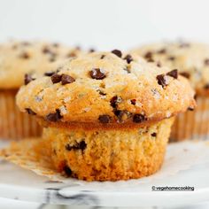 two chocolate chip muffins on a plate