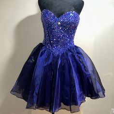 Short Purple Strapless Rhinestones Dress Corset Style Crystal Embellished Dresses For Homecoming During Prom Season, Crystal Embellished Dresses For Homecoming And Prom, Strapless Prom Dresses With Rhinestones, Strapless Rhinestone Dress For Prom Season, Strapless Rhinestone Dress For Prom, Strapless Rhinestone Prom Dress, Cocktail Dress With Rhinestones And Sweetheart Neckline, Blue And Purple Dress, Corset Dress Short