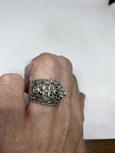 Vintage ring surrounded by Swiss cut fine Marcasite Sterling silver Size 6 can be sized by my jeweler. His service charge is $10-$20 All rings are shipped free in the US in a nice gift box. Check out our over a THOUSAND great reviews Engraving is $4 per letter and is not always perfect depending on the piece. It can take a few days if the jeweler is busy. This is payable to Paypal Judithsltd@gmail.com Art Deco Silver Filigree Ring As Gift, Silver Art Deco Filigree Ring As Gift, Silver Filigree Ring, Art Deco Style, Gift, Classic Marcasite Jewelry For Anniversary, Silver Art Deco Filigree Ring Gift, Art Deco Stamped 925 Silver Jewelry As Gift, Art Deco 925 Stamped Jewelry Gift, Marcasite Anniversary Rings Stamped 925, Marcasite Ring For Anniversary