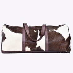 Upgrade your travel experience with our premium Cowhide Leather Duffle Bag. Handcrafted with care and precision, this bag is made from genuine cowhide leather, ensuring a durable and luxurious accessory that stands the test of time. The unique cowhide pattern in rich brown tones adds a touch of natural beauty and sophistication to your travel ensemble. Our spacious duffle bag offers ample storage space for all your travel essentials. Whether you're heading for a weekend getaway, a gym session, o Leather Duffel Bag, Leather Duffel, Cowhide Bag, Leather Weekender, Sac Week End, Leather Duffle Bag, Leather Duffle, Travel Duffel, Duffel Bags