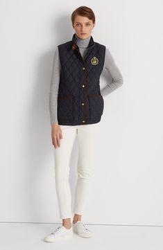 A diamond-quilted vest is accented with a signature LRL crest at the chest for a standout choice in dressing for transitional weather this season. 26" length (size Medium) Stand collar Lined, with 100% polyester fill 100% polyester Dry clean or machine wash, tumble dry Imported Cotton Vest With Padded Collar And Sleeveless Design, Navy Sleeveless Vest For Fall, Quilted Vest For Workwear In Fall, Quilted Vest For Fall Workwear, Quilted Sleeveless Vest For Workwear, Cotton Sleeveless Vest With Padded Collar, Sleeveless Cotton Vest With Padded Collar, Fall Cotton Quilted Vest, Luxury Casual Quilted Vest