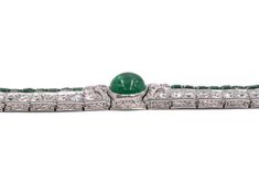 For Sale on 1stDibs - Art Deco Emerald and Diamond Bracelet. This bracelet has cabochon and square- cut emeralds, old and single-cut diamonds all set in platinum, Length 6.875 Fine Jewelry Platinum Cabochon, Luxury Silver Tennis Bracelet With Emeralds, Fine Jewelry In Platinum With Cabochon, Formal White Gold Diamond Bracelet With Emerald, Emerald Diamond Bracelet In White Gold For Formal Events, Formal Silver Diamond Bracelet With Emeralds, Formal Silver Tennis Bracelet With Emeralds, Formal Silver Emerald Tennis Bracelet, Silver Emerald Tennis Bracelet For Formal Occasions