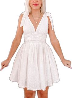 White V-neck Mini Dress With Tie Straps, Mini Lace Dresses With Tie Straps, Lace Mini Dress With Tie Straps, White Broderie Anglaise Mini Dress For Brunch, White Eyelet Dress For Brunch, Fitted Sleeveless Eyelet Mini Dress, Chic Sleeveless Broderie Anglaise Mini Dress, White Eyelet Dress For Spring, White Sleeveless Eyelet Mini Dress