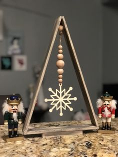 two nutcracker figurines sitting on top of a counter