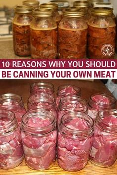 mason jars filled with meat sitting on top of a wooden table