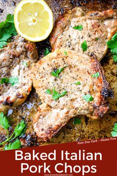 baked italian pork chops with lemon and parsley garnish on the side