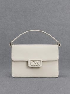 A polished and pristine all-white leather bag is an investment-worthy piece that deserves a spot in your capsule wardrobe - our boxy bag is a case in point. Made with genuine calf leather, this bag feels as luxurious as it looks. It opens up to a roomy main compartment that can hold your essentials and then some. The matching white hardware is polished and striking. Fitted with a thick shoulder strap that is also made with soft and supple leather, it will hang comfortably on your shoulder. Designer White Rectangular Case Bag, Chic Rectangular Box Bag With Branded Hardware, Luxury White Rectangular Case Bag, Luxury White Rectangular Shoulder Bag, White Rectangular Box Bag For Shopping, Modern Box Bag With Branded Hardware For Office, White Rectangular Case Shoulder Bag For Shopping, White Classic Rectangular Case Bag, Classic White Rectangular Case Bag