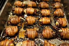 bacon wrapped in strips on a baking sheet