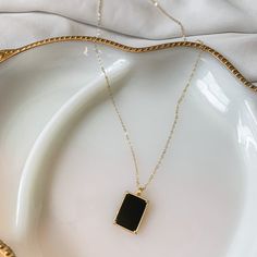 HIGH QUALITY 14k GOLD FILLED BLACK ONYX NECKLACE | Dark Matter Black Onyx Necklace | gold filled | layering necklace | tag pendant | 14k gold | 18k gold | cable chain | herringbone | natural gemstone*FREE SHIPPING** tarnish resistant, lead and nickel free necklaces * * Buy the set and get 8% DISCOUNT *STUDIO TWENTY NINE "DARK MATTER" NECKLACE SETDETAILS:Materials & Style:• Closure: Lobster clasp• Black onyx natural gemstone set in 14k gold filled rectangle pendant on 14k gold filled cable ch Black Gold-plated Adjustable Chain Jewelry, Gold Onyx Necklace With Adjustable Chain, Gold Onyx Pendant Jewelry, Black Necklace With Adjustable Chain And Rectangular Pendant, Black 14k Gold Pendant Jewelry, Everyday Black Clavicle Chain Charm Necklace, Elegant Everyday Jewelry With Black Enamel, Minimalist Black Gold Plated Jewelry, Elegant Everyday Black Enamel Jewelry