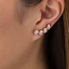 Creative and clever, these lunar crawler earrings make any day magical. Crafted in sterling silver with 14K rose gold plate, each whimsical earring features a curved quartet of sculpted circles - each adorned with four petite lab-created shimmering white sapphires in crescent moon-shaped frames. Buffed to a brilliant luster, these earrings secure with long wire backs that stabilize the climbing design. Minimalist Rose Gold Pierced Ear Climbers, Minimalist Rose Gold Sterling Silver Ear Climbers, Elegant Rose Gold Sterling Silver Cartilage Earrings, Dainty Rose Gold Sterling Silver Ear Climbers, Dainty Rose Gold Sterling Silver Ear Cuff, Rose Gold Sterling Silver Ear Cuff For Gift, Rose Gold Sterling Silver Single Ear Cuff, Delicate Rose Gold Ear Climbers As Gift, Delicate Rose Gold Ear Climbers For Gift