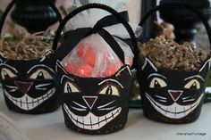 three baskets filled with candy and candies on top of a table