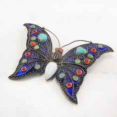 "More Unique Sterling Silver Brooches: https://www.etsy.com/shop/SilverStarrs925?section_id=15203699 Beautiful  Silver Brooch This brooch is 2 1/8\" inches long It is 3 1/4\" inches wide The brooch weighs 18.4 Grams The stone or design featured on this brooch is Enamel, Turquoise Butterfly  The color of the stone or design is Blue, Red, White, Green, Orange Markings, if any are: C1992, MMA, Cleo, Ag, (Tested & Guaranteed to be Sterling Silver) The condition of this brooch is Very good, the patin Silver Multi-stone Brooches, Handmade Turquoise Brooches For Collectible, Traditional Handmade Sterling Silver Brooches, Turquoise Brooch Jewelry Gift, Handmade Silver Enamel Pin Collectible, Handmade Silver Enamel Pin For Collectors, Silver Bohemian Brooches For Collectors, Turquoise Cabochon Brooch As A Gift, Turquoise Cabochon Brooch For Gift