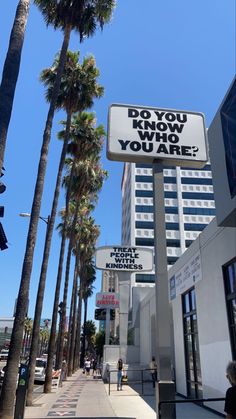 a sign that says do you know how you are? on the side of a street