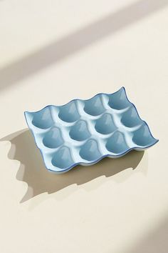 an empty blue tray sitting on top of a table