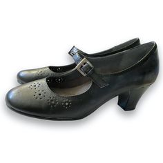 Aerosoles Faux Black Leather Mary Jane Shoes With a Buckle Closure & Low 2.5” Block Heel & Perforated Eyelet Lace Accents. 
Adorable shoes that are designed to be incredibly comfortable.
Label Size 7M- Run True to Size
New without Box Condition- A few minor scuffs from being moved about in the closet, see final pic. Smoke & Fragrance Free Home.
Pics show reflections off the faux leather, that are not flaws in the shoes.
- faux leather that mimics the real thing 
- round toe shape; block heel
- perforated floral accents 
- adjustable buckle closure
- cushioned insole, arch support
- flexible slip-resistant outsole
All Man Made Materials Home Pics, Leather Mary Jane Shoes, Mary Jane Heels, Leather Mary Janes, Jane Shoes, Eyelet Lace, The Closet, Leather Buckle, Fragrance Free