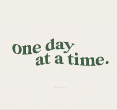 the words one day at a time written in green ink