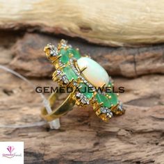 Sale! Genuine Opal Gemstone Ring, Pave Diamond Jewelry, Emerald Gemstone Ring, 925 Silver Gold Vermeil Jewelry, Beautiful Ring, Gift For her Gross Weight: 13.29 gram Gemstone Weight: 10.51 cts Diamond Weight: 1.30 cts Ring Size: 38X33 MM NOTE:- All The Products Are Designed And Manufactured In My Workshop By Me & My Team. Shown Products Are Purely Handmade. Custom Orders Are Open Handly Accepted. We Are the Perfect Choice For Any Custom Jewelry Manufacturing. For Bulk Orders Please Message m Opal Ring With Diamond Gemstone Accents, Diamond Gemstones With Stone Setting For Anniversary, Oval Emerald Ring Fine Jewelry, Fine Jewelry Gemstones With Stone Setting For Wedding, Fine Jewelry Wedding Gemstones With Stone Setting, Anniversary Opal Ring With Gemstone Accents In Sterling Silver, Anniversary Sterling Silver Opal Ring With Gemstone Accents, Opal Ring With Gemstone Accents For Anniversary, Sterling Silver Opal Ring With Gemstone Accents For Wedding